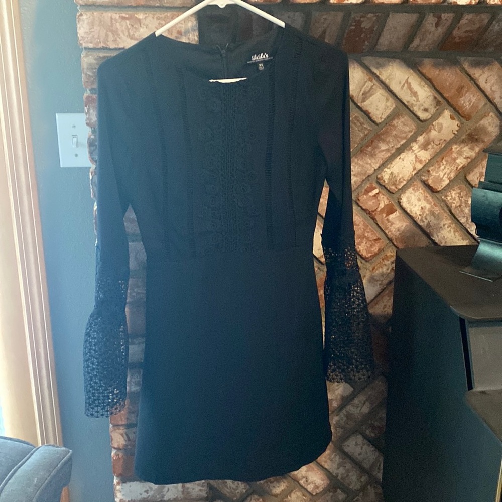 Pretty black Lulus dress with bell sleeves and eyelet detail. Size XS